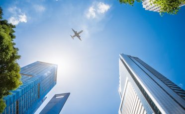 airplane-flying-skyscrapers_1359-679 airplane-flying-skyscrapers_1359-679